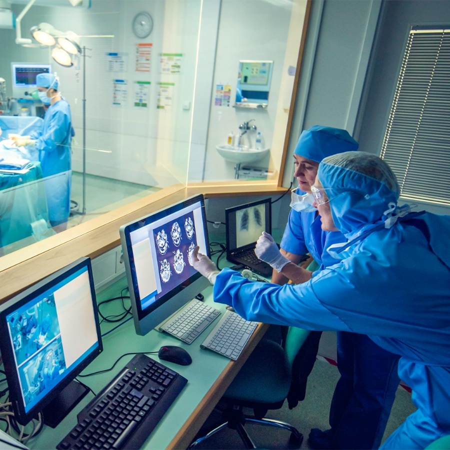 Doctors at hospital looking at MRI Scans on computer