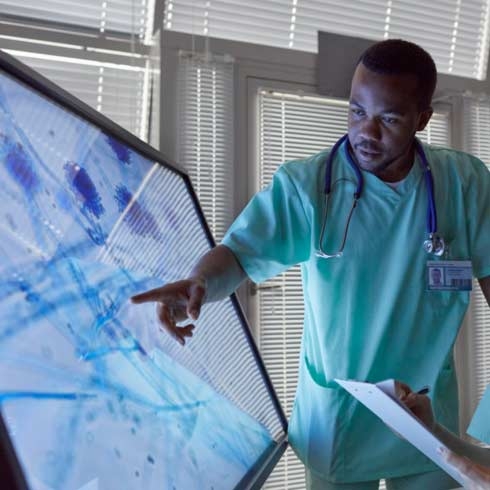 Two doctors assessing medical images