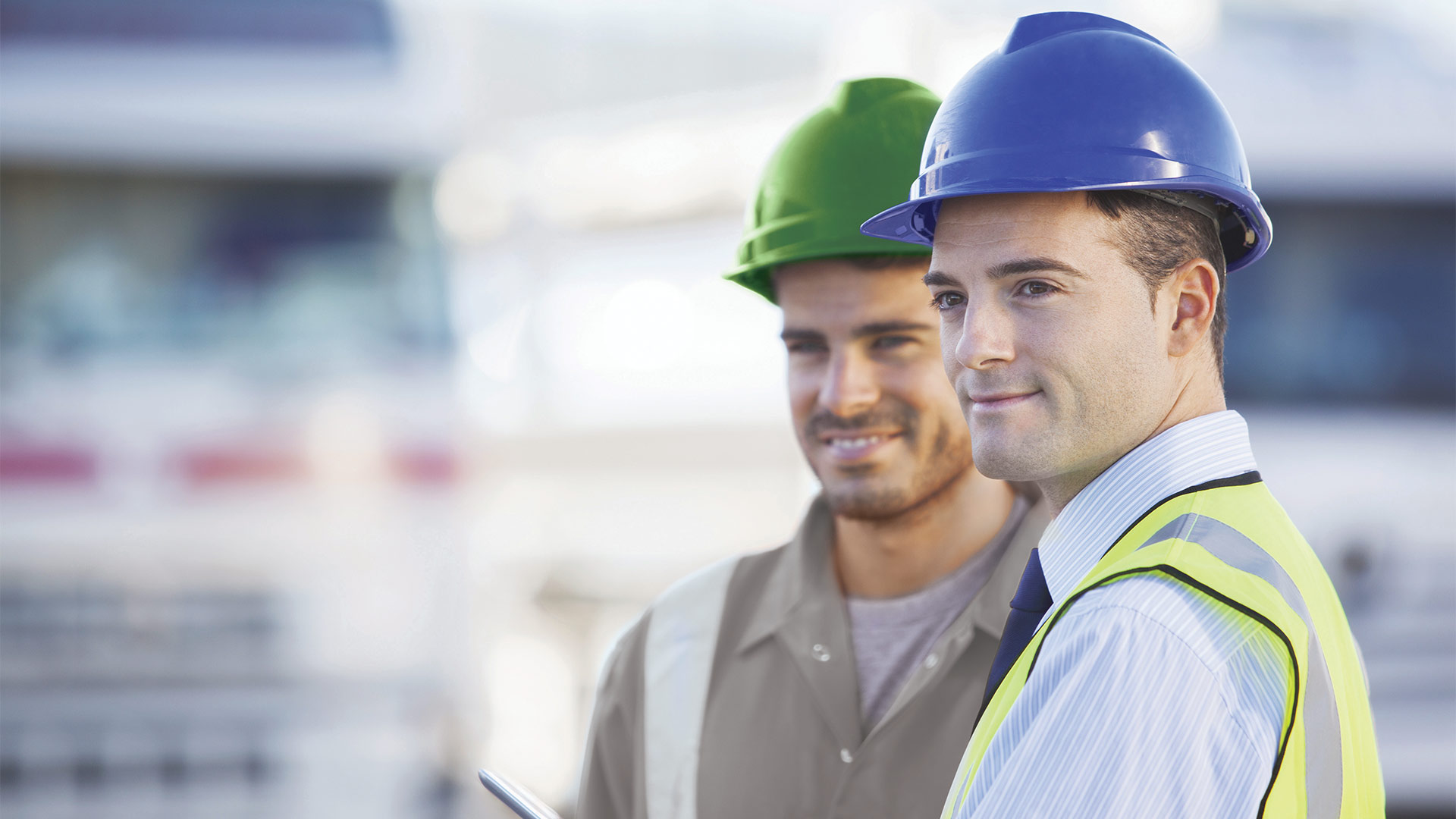 two men wearing helmets