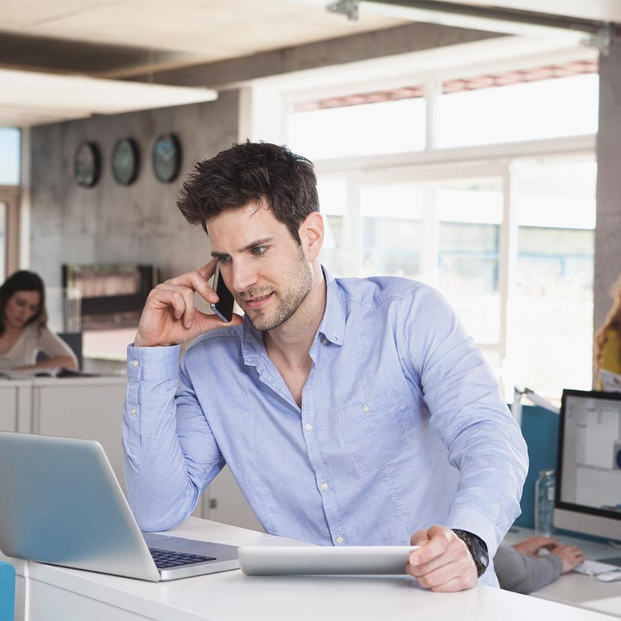 A customer service representative smiling at the camera.