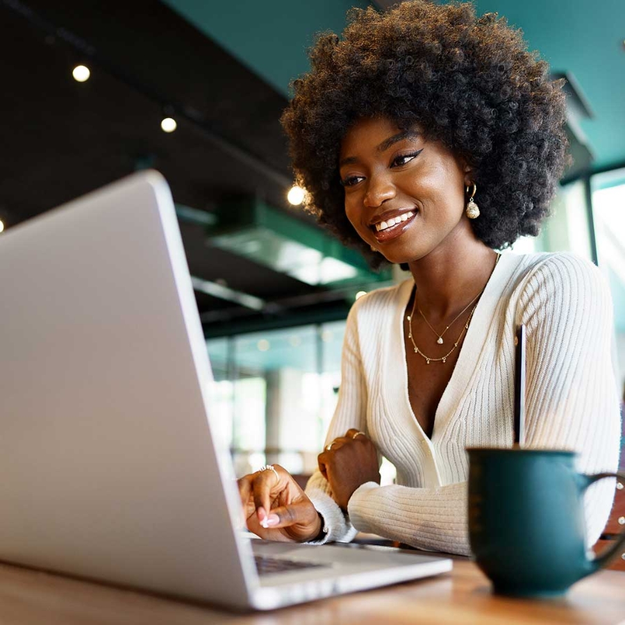 A woman looking at a laptop