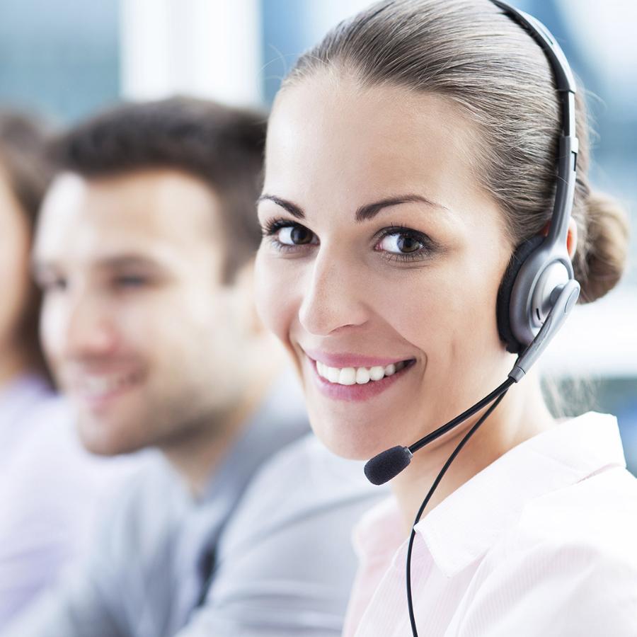 A customer service center employees working at their stations.